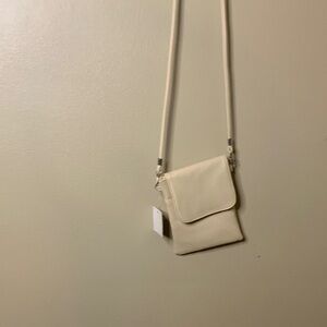 Compact Cream Crossbody Bag with Flap Closure